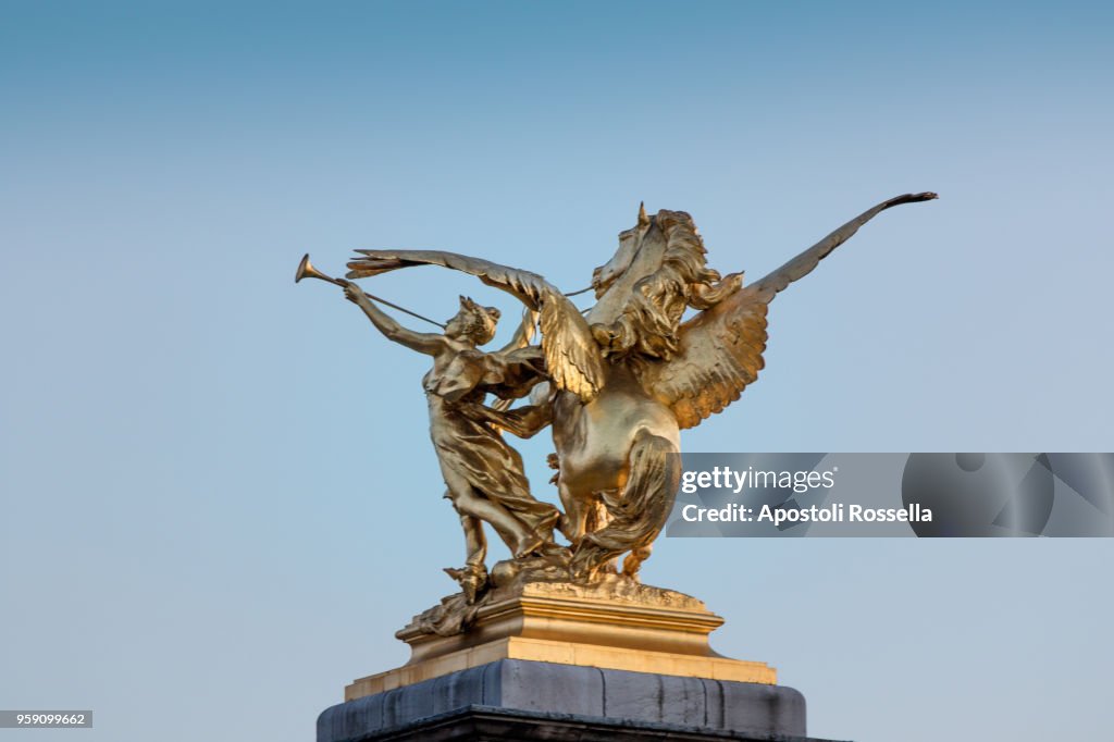Pegasus gold statue on Pont Alexandre III over Seine River