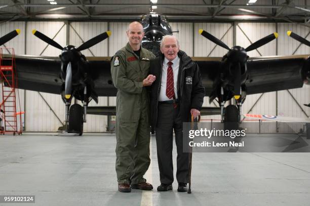 Wing Commander John Butcher, Commanding Officer of 617 Squadron, jokes with Britain's last surviving 'Dambuster', Squadron Leader George "Johnny"...