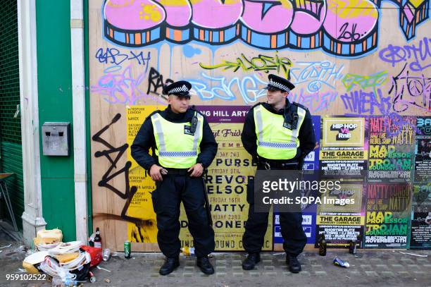 Police officers keep watch on the second and final day of the 2016 Notting Hill Carnival in west Londonby some accounts the 50th anniversary of the...