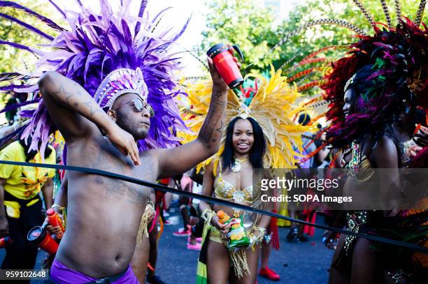 Parade particpants in brightly-coloured costumes party on the second and final day of the 2016 Notting Hill Carnival in west Londonby some accounts...