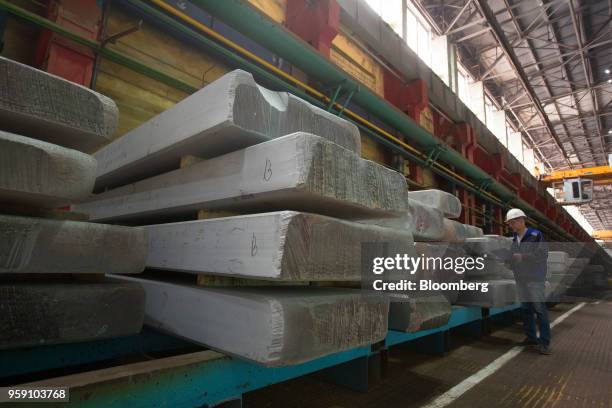 Worker checks slabs of titanium alloy in a storage area at the VSMPO-AVISMA Corp. Plant in Verkhnyaya Salda, Russia, on Monday, May 14, 2018. The...