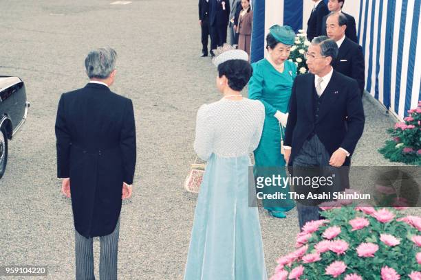Prince Mikasa and Princess Yuriko of Mikasa are welcomed by Prince Hitachi and Princess Hanako of Hitachi are seen on arrival at a tea party hosted...