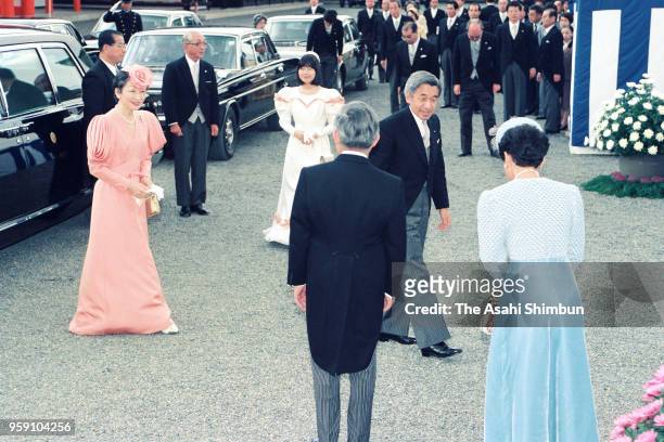 Emperor Akihito and Empress Michiko are welcomed by Prince Hitachi and Princess Hanako of Hitachi on arrival at a tea party hosted by Imperial...