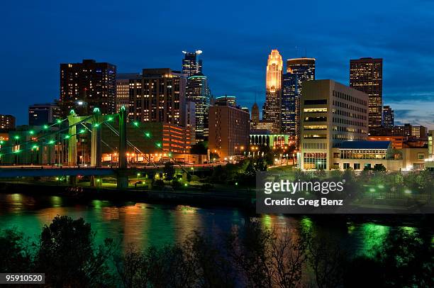 a green glow over downtown minneapolis - downtown minneapolis stock pictures, royalty-free photos & images