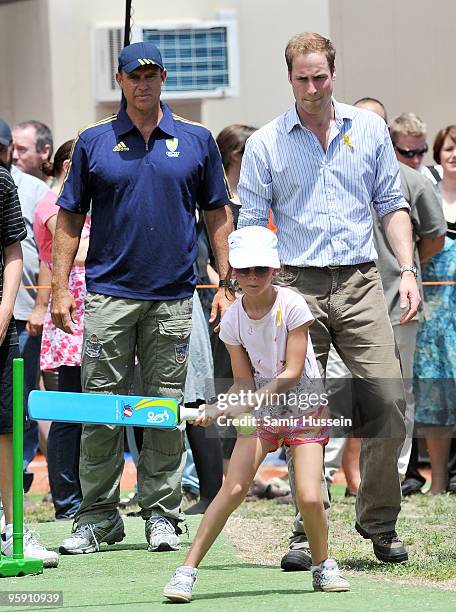 Matthew Hayden and HRH Prince William chat as children play cricket at the Flowerdale community event on the third and final day of his unofficial...