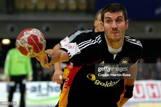 Michael Haass of Germany plays the ball during the Men's Handball European Championship Group C match between Slovenia and Germany at the Olympia...