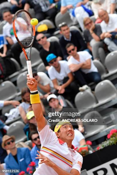 Japan's Kei Nishikori serves to Bulgaria's Grigor Dimitrov during Rome's ATP Tennis Open tournament at the Foro Italico, on May 16, 2018 in Rome.