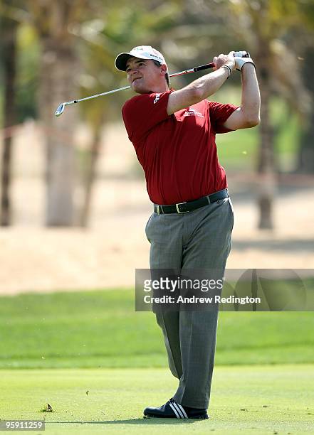 Paul Lawrie of Scotland hits his second shot on the ninth hole during the first round of The Abu Dhabi Golf Championship at Abu Dhabi Golf Club on...