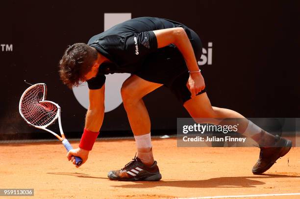 Dominic Thiem of Austria smashes his racket in frustration in his match against Fabio Fognini of Italy during day four of the Internazionali BNL...