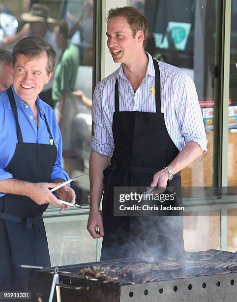 Prince William cooks on a BBQ as he visits the bushfire affected township of Flowerdale on the third day of his visit to Australia on January 21,...