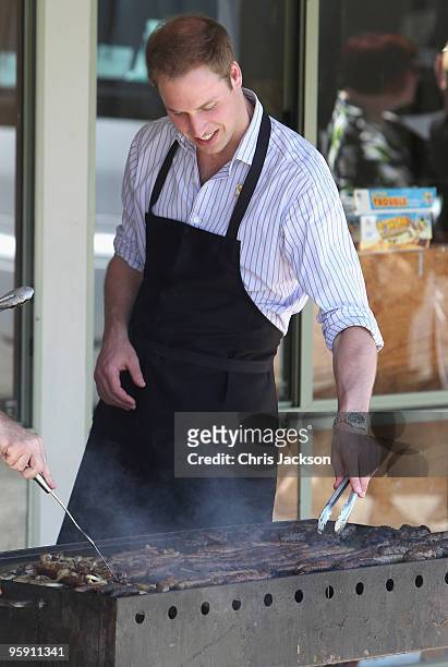 Prince William cooks on a BBQ as he visits the bushfire affected township of Flowerdale on the third day of his visit to Australia on January 21,...