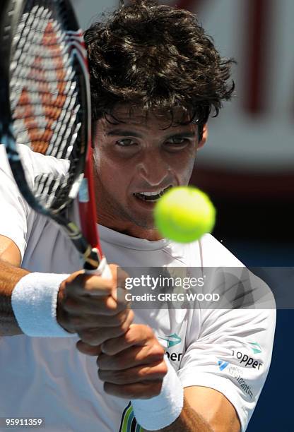 Brazilian tennis player Thomaz Bellucci plays a stroke during his men's singles match against US opponent Andy Roddick on the third day of play at...