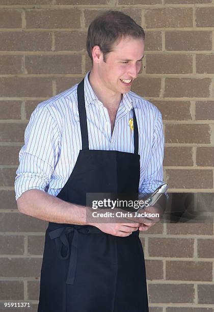 Prince William cooks on a BBQ as he visits the bushfire affected township of Flowerdale on the third day of his visit to Australia on January 21,...