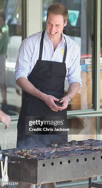 Prince William cooks on a BBQ as he visits the bushfire affected township of Flowerdale on the third day of his visit to Australia on January 21,...