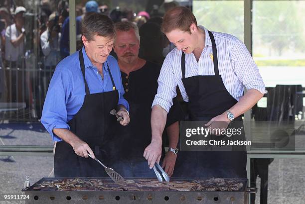 Prince William cooks on a BBQ as he visits the bushfire affected township of Flowerdale on the third day of his visit to Australia on January 21,...