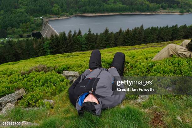 Spectators wait for an RAF Typhoon to fly over the Derwent Dam in the Upper Derwent Valley on May 16, 2018 in Sheffield, England. The Typhoon...