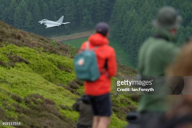 An RAF Typhoon flies over the Derwent Dam in the Upper Derwent Valley on May 16, 2018 in Sheffield, England. The Typhoon replaced a planned flight by...