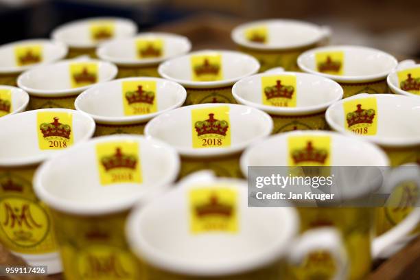 Cups are prepared as part of a special collection ahead of the wedding of Prince Harry and Meghan Markle at William Edwards Home Ltd on May 16, 2018...