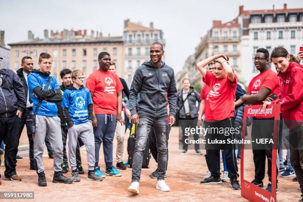 Eric Abidal kicks with members of Special Olympics at the Fan Zone ahead of the UEFA Europa League Final between Olympique de Marseille and Club...