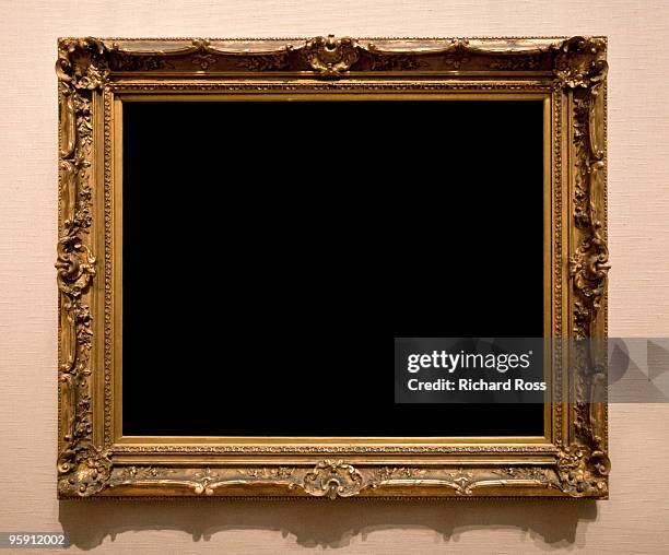 ornate gold frame on a brown wall - picture frames on wall stock pictures, royalty-free photos & images