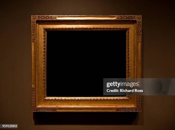 ornate gold frame on a brown wall - empty museum stock pictures, royalty-free photos & images