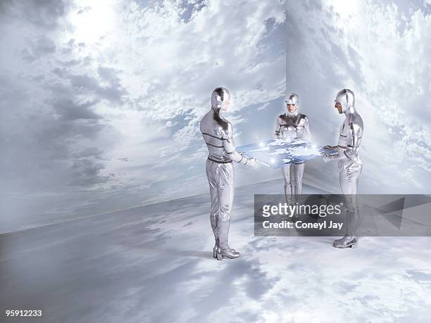 futuristc figures holding holographic world map - coneyl - fotografias e filmes do acervo