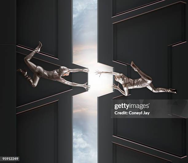 dancers opening giant doors - dernière pièce du puzzle photos et images de collection