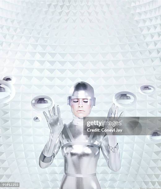 futuristic woman in haptic feedback chamber - mind reading stock pictures, royalty-free photos & images