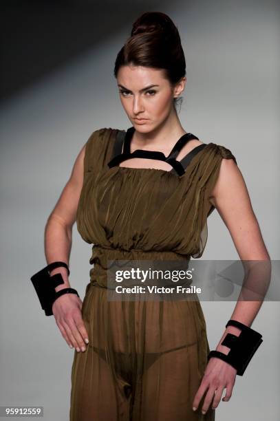 Model displays a creation of Wines Chan on the catwalk during the HK Fashion Designers Association show as part of the Hong Kong Fashion Week...