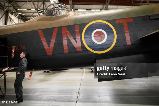 Members of the groundcrew work on one of two surviving airworthy Avro Lancaster bombers ahead of an event to mark the 75th anniversary of the...