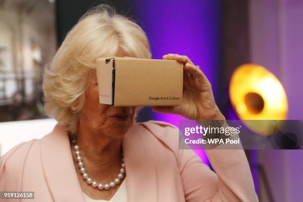 Camilla, Duchess of Cornwall looks through a virtual reality viewer during a visit to the YouTube Space London at Kings Cross on May 16, 2018 in...