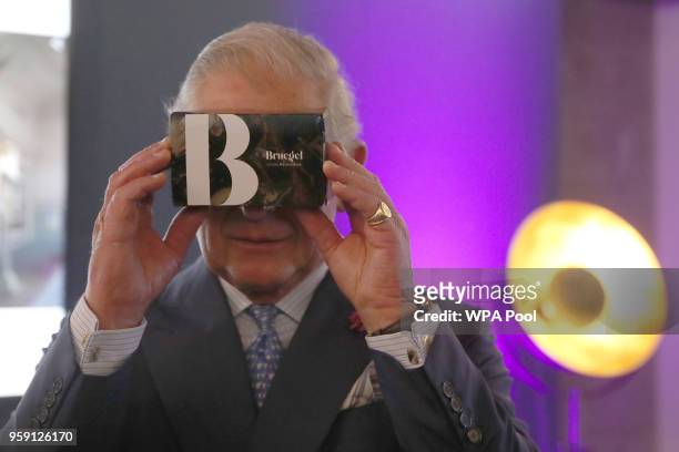 Prince Charles, Prince of Wales Looks through a virtual reality viewer during a visit to the YouTube Space London at Kings Cross on May 16, 2018 in...