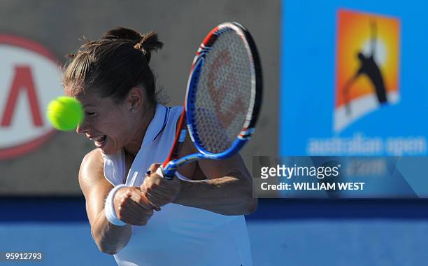 British tennis player Katie O'Brien plays a backhand return during her women's singles match against Serbian opponent Jelena Jankovic on the third...