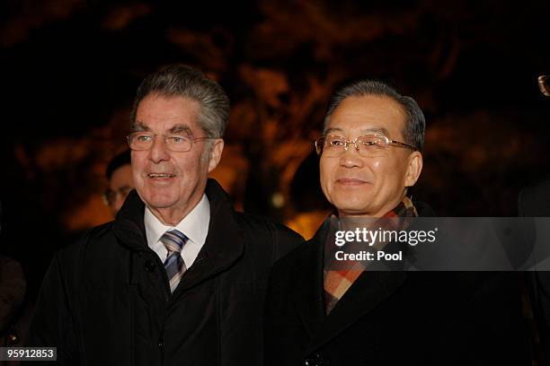 Austrian President Heinz Fischer poses with China's Premier Wen Jiabao before a dinner reception at Diaoyutai State Guest House on January 21, 2010...