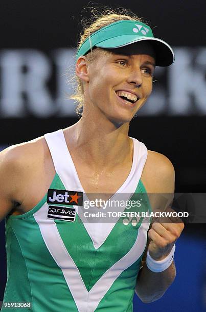 Elena Dementieva of Russia celebrates winning a point against Justine Henin of Belgium in their women's singles second round match on day three of...