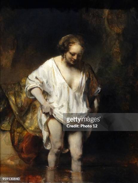 Painting titled 'A Woman bathing in a Stream' by Rembrandt Harmenszoon van Rijn a Dutch painter and etcher. Dated 17th Century.