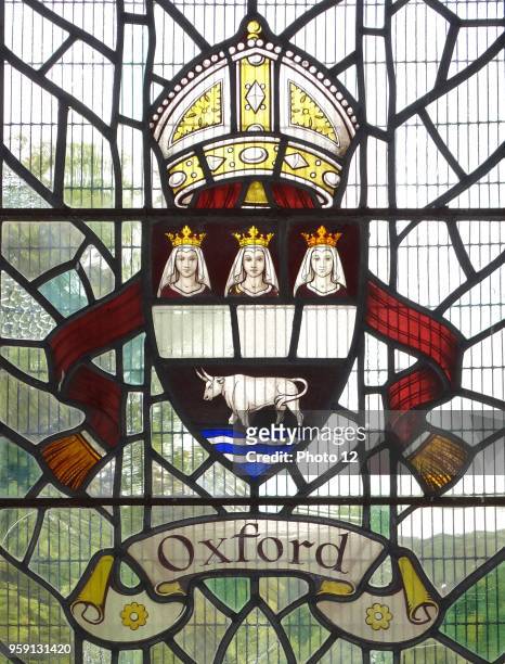 Oxford crest with a bull and mitre, in a stained glass window at Hughenden Manor, England. Hughenden is closely associated with the former Prime...