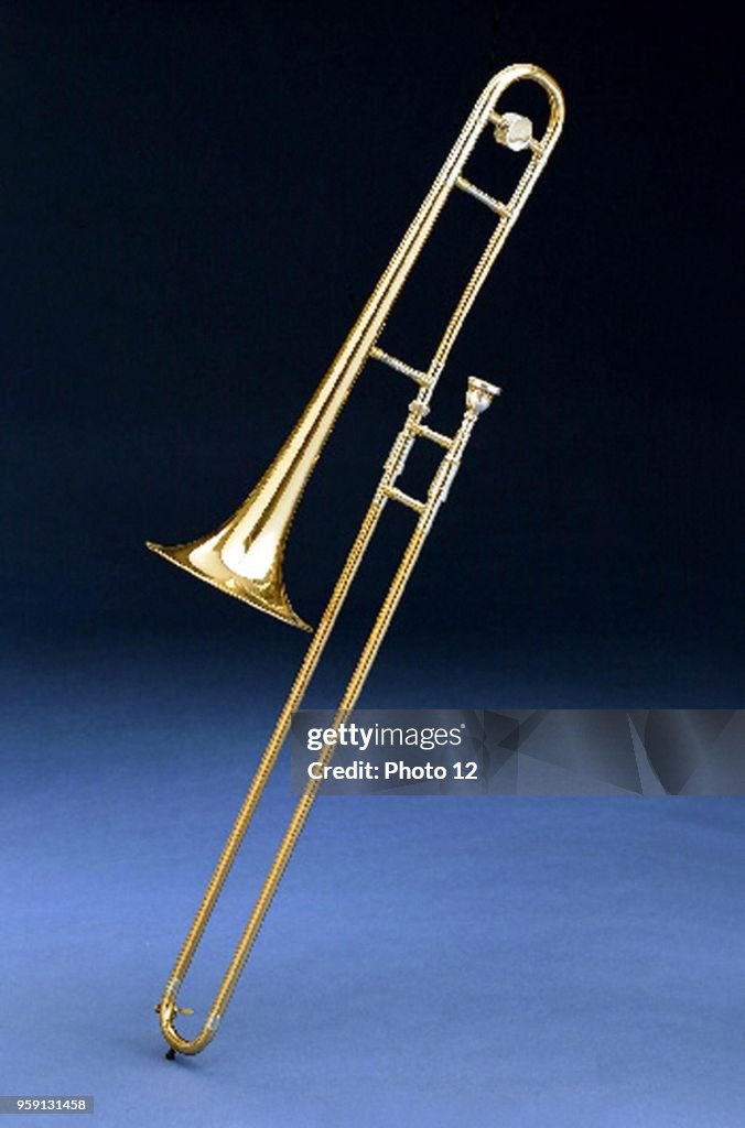 Trombophone Shell Instrument Brass wind musical instrument of cylindrical bore, having a sliding ...