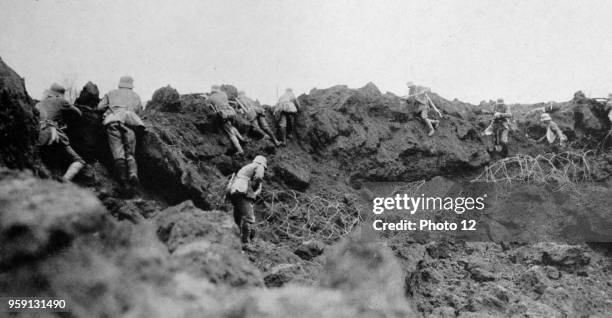 World War One German infantry advance from a trench under allied gunfire. 1915.