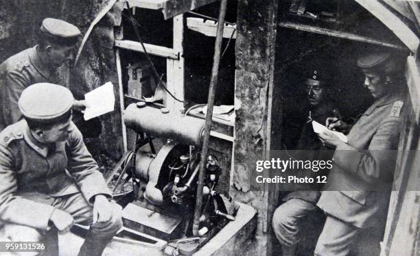 Photograph of Soldiers using wireless telegraphy station near the River Meuse in Belgium. Dated 1914.