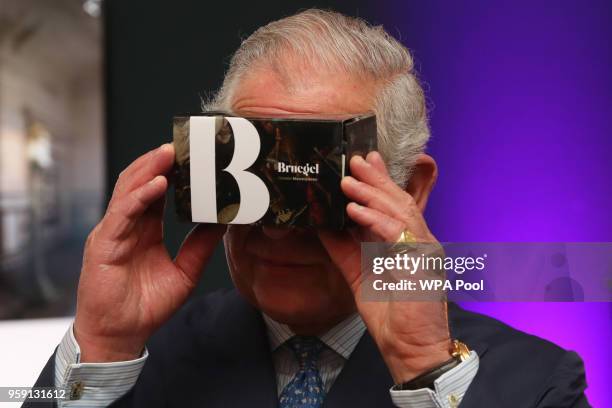 Prince Charles, Prince of Wales looks through a virtual reality viewer during a visit to the YouTube Space London at Kings Cross on May 16, 2018 in...