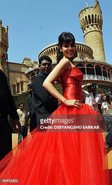 Bollywood actor Genelia D'Souza poses in front of the Bangalore Palace at Virgin Mobiles GSM service launche in Bangalore on January 21, 2010. Virgin...