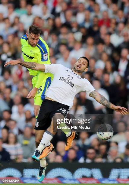 Richard keogh, of Derby County, gets to a header before Fulham's Aleksandar Mitrovic during the Sky Bet Championship Play Off Semi Final Second Leg...