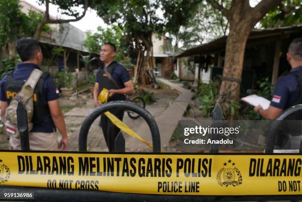 Special polices Densus 88 antiterror squad set a police line in house linked with terrorist activity at Jalan Delima in Tangerang, Indonesia on May...