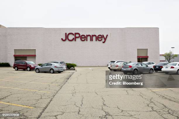 Vehicles sit parked outside a J.C. Penney Co. Store in Peoria, Illinois, U.S., on Saturday, May 12, 2018. J.C. Penney Co. Is scheduled to release...