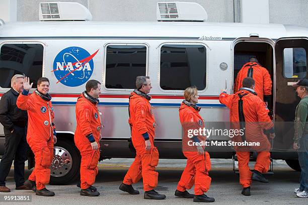 Space Shuttle Endeavour astronauts mission specialists Robert Behnken, Nicholas Patrick, Stephen Robinson, and Kathryn Hire, pilot Terry Virts and...