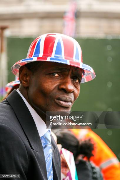 close up of african ethnicity man wearing british union jack hat at royal wedding - jack lord stock pictures, royalty-free photos & images