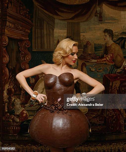 German model Alena Gerber poses wearing a full chocolate dress during the presentation of chocolate dresses designed by German bakery group Lambertz...