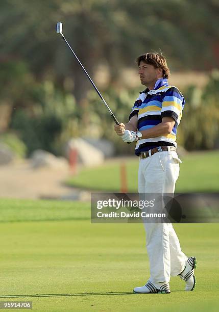 Robert-Jan Derksen ofTthe Netherlands plays his second shot at the par 5, 18th hole during the first round of The Abu Dhabi Golf Championship at Abu...