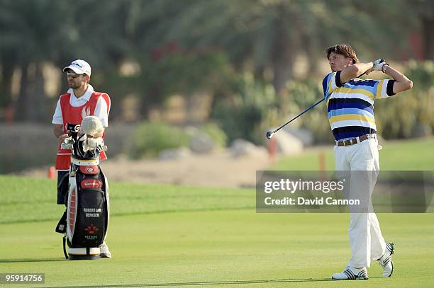 Robert-Jan Derksen ofTthe Netherlands plays his second shot at the par 5, 18th hole during the first round of The Abu Dhabi Golf Championship at Abu...